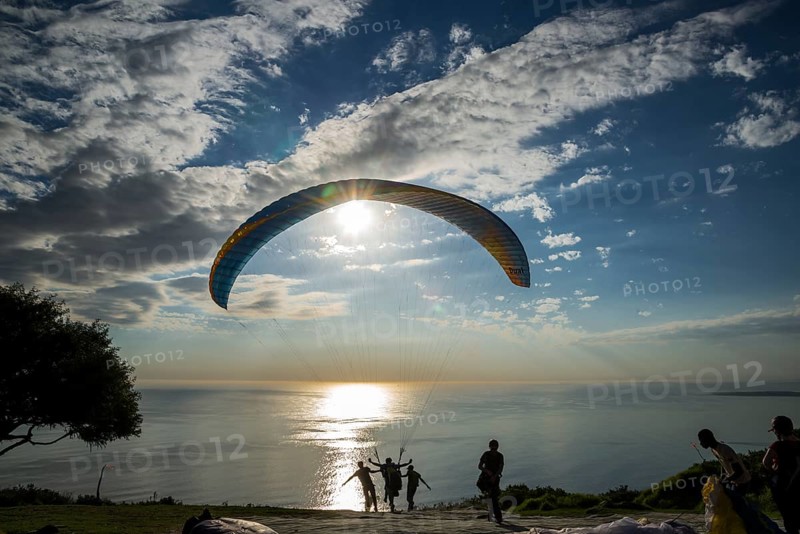 Paraglider at the start to a tandem jump