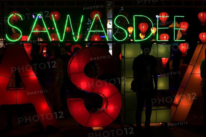Sawasdee' lettering in neon lights