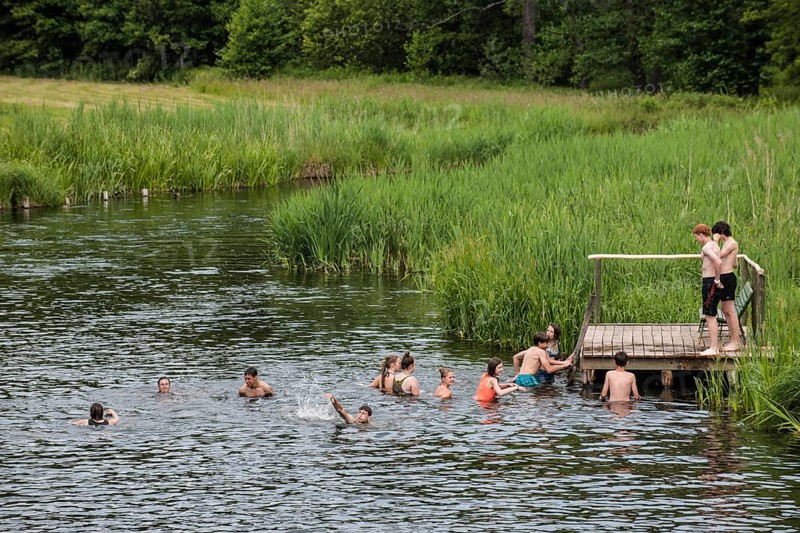 Young people bathing in the Krutynia River