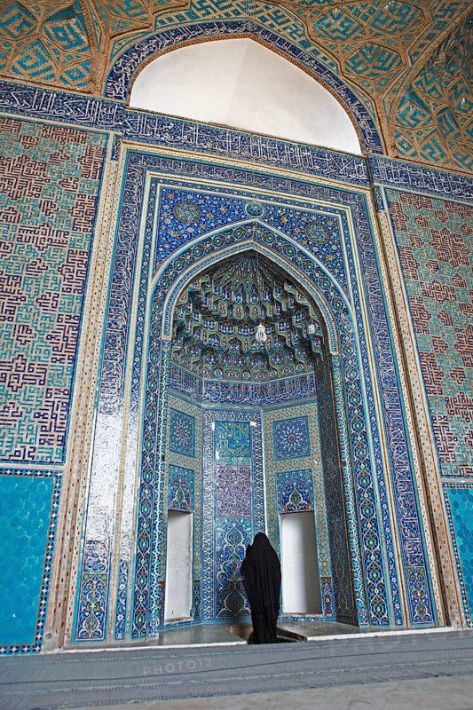 Woman praying in the Masjed-i Jame Mosque or Friday Mosque