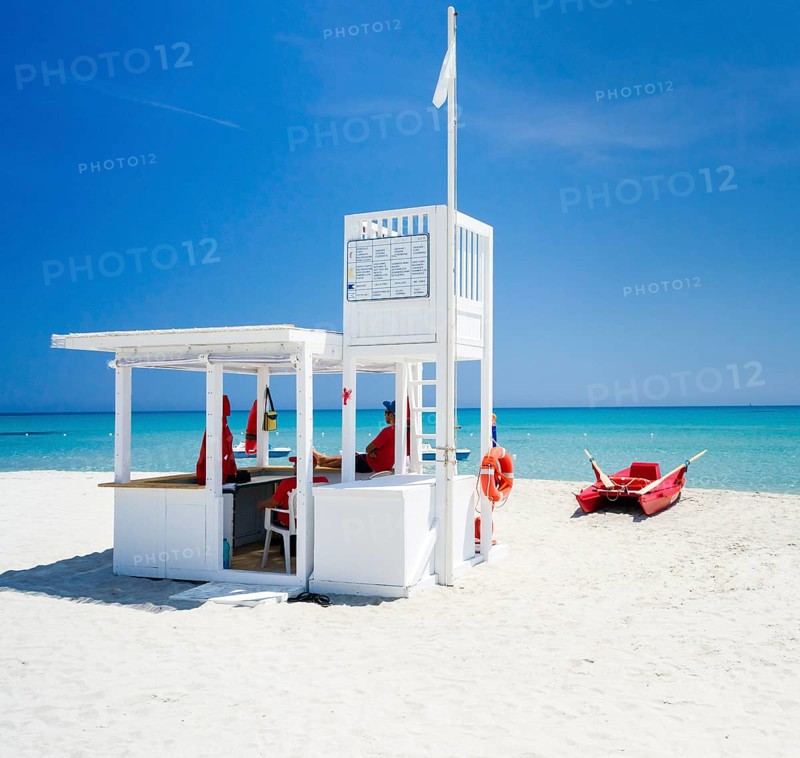Lifeguard tower and rescue boat on the beach of Simius