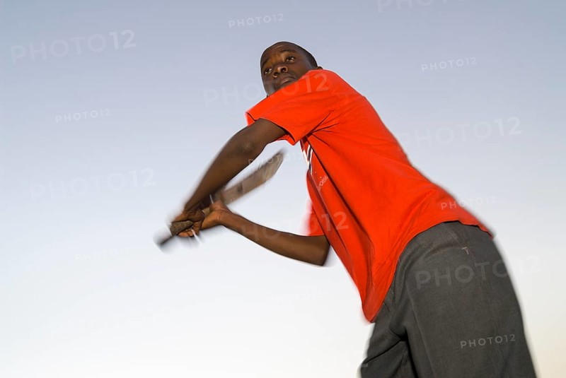 Boy playing cricket