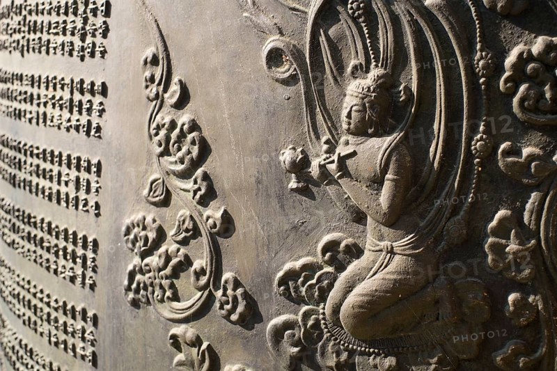 Relief in an ancient bronze bell at Chokseongnu Pavilion