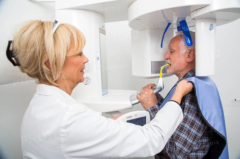 Man being prepared for an X-ray of his teeth