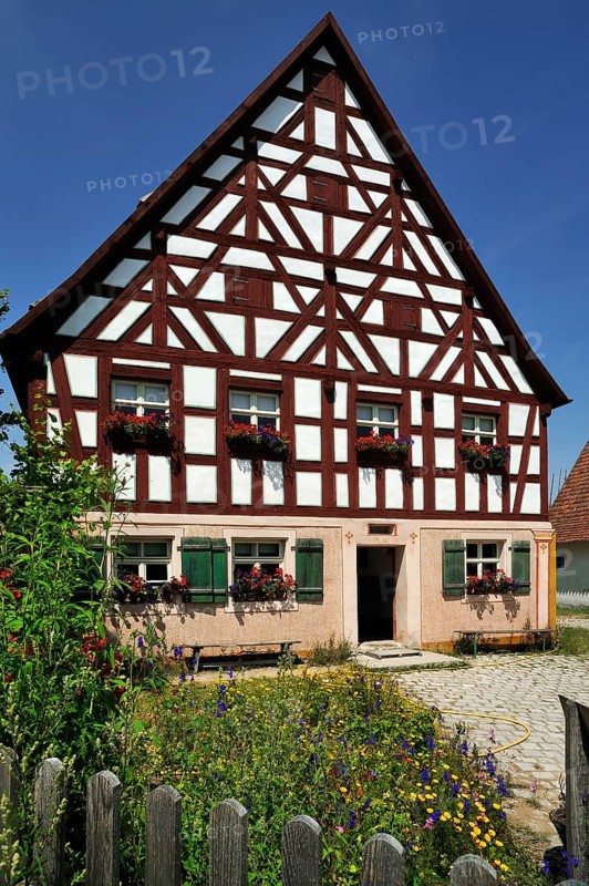 Half-timbered farmhouse on stone base