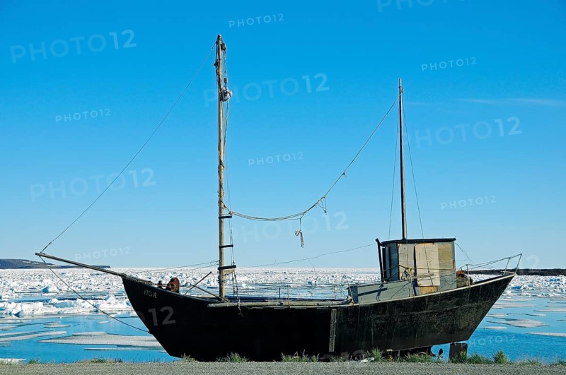 Old ship on the shore of the Beaufort Sea