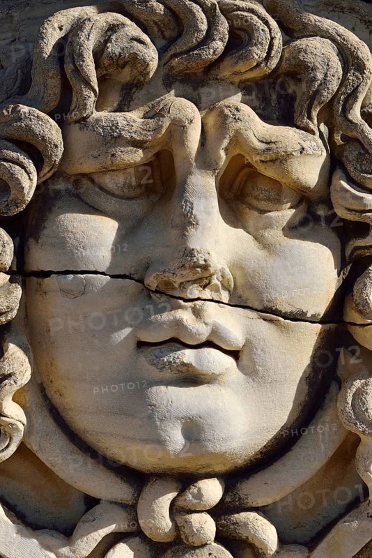 Antique Medusa or Gorgon head at the Apollon temple