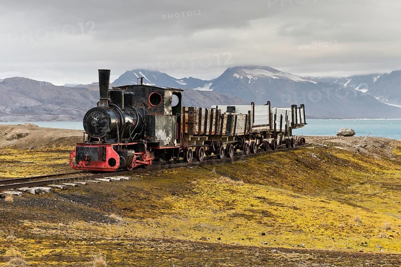 Historic mine train in front of the Kongsfjorden