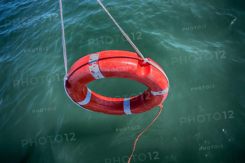 Lifebuoy dangling over water