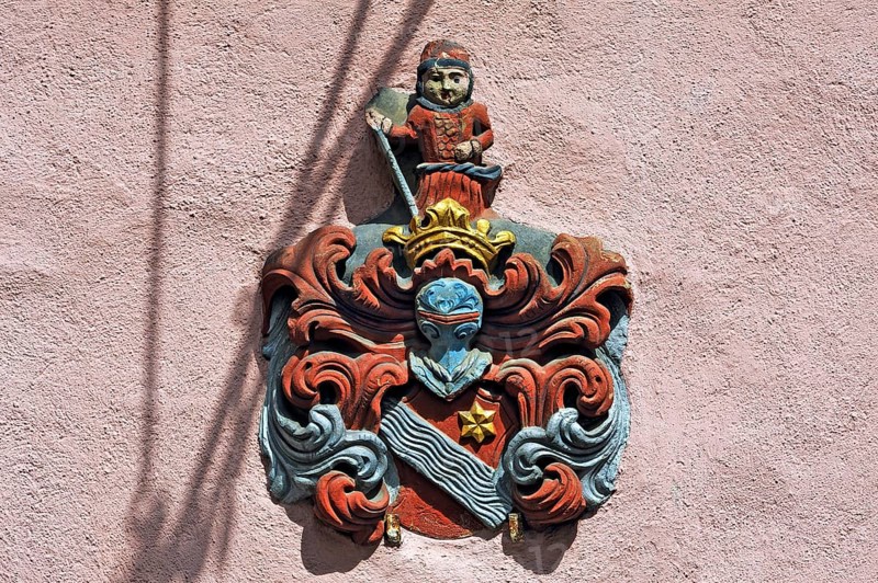 Coat of arms plaque of the Hoffmann family on a facade