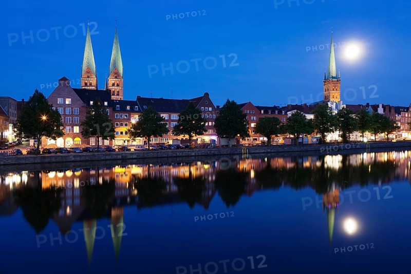 Trave river and the historic centre at full moon