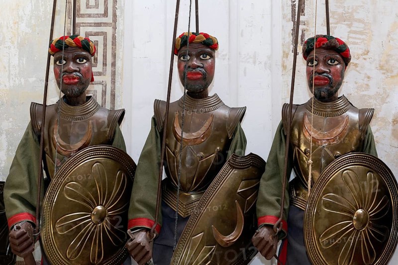 Three dark-skinned Moor-warriors in armour