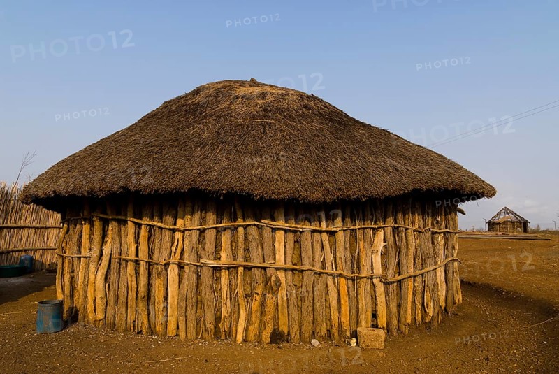 Round hut made of tree trunks