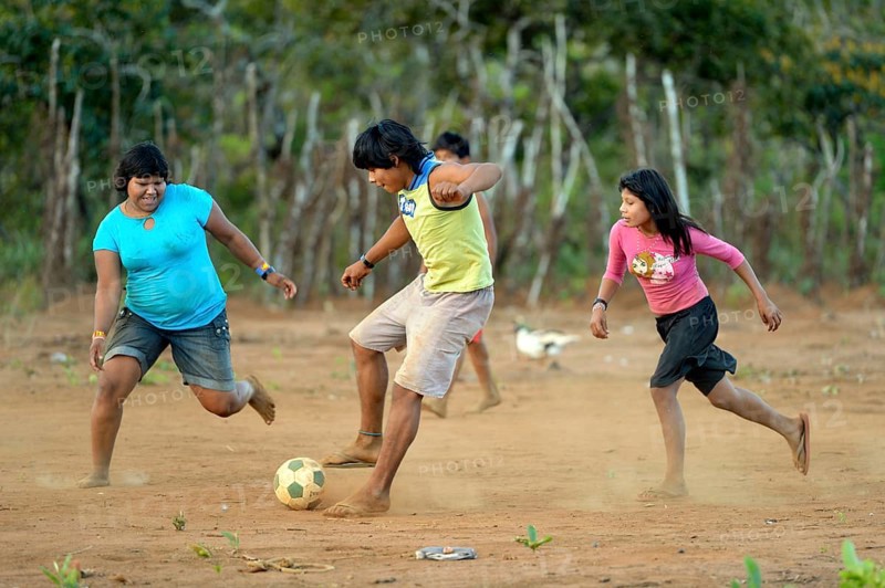 Youngers of the indigenous Xavante people playing football