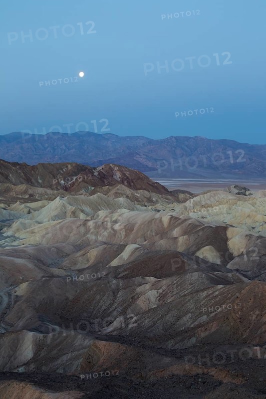Full moon over the Panamint Range and the Death Valley at dawn