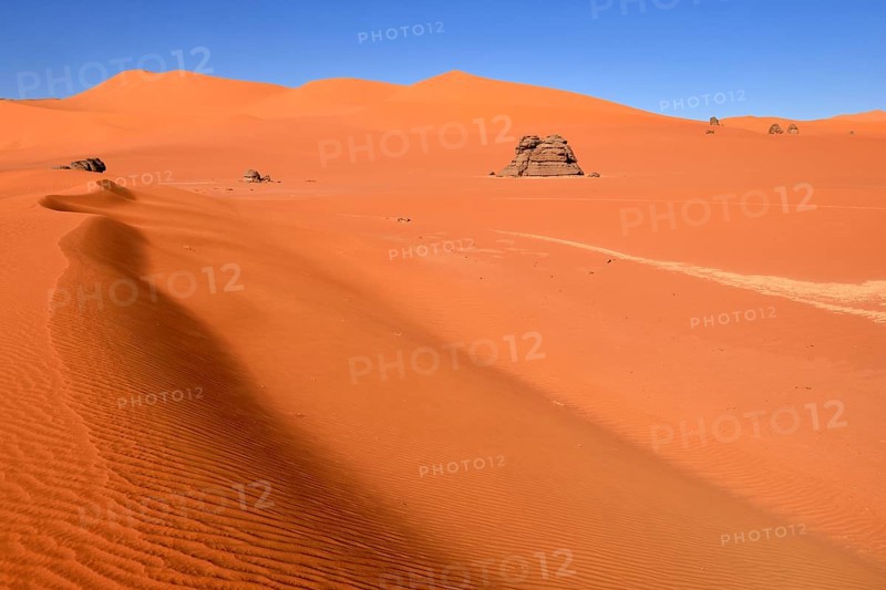 Sand dunes and rocks at Tin Merzouga