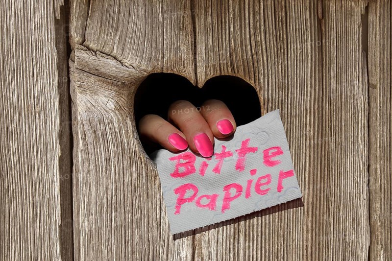 Hand holding a note