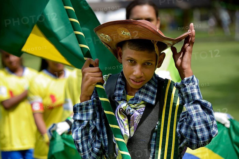 Flag bearer of the Brazilian team wearing the traditional costume of the peasants of the Brazilian Northeast
