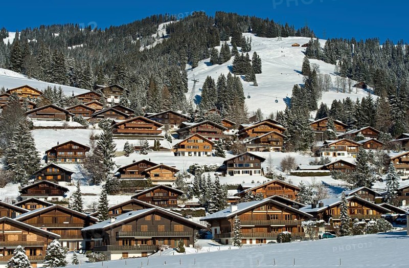 Swiss chalets in a winter landscape in Saanenland