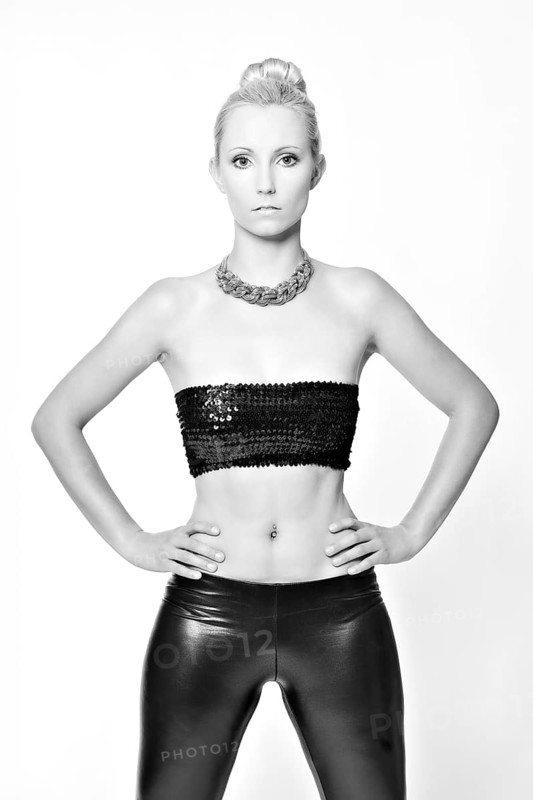 Woman with her hair in a bun wearing a bandeau top