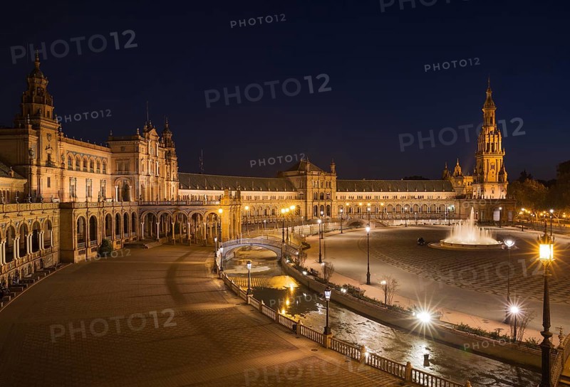 The illuminated Plaza de Espana at dusk