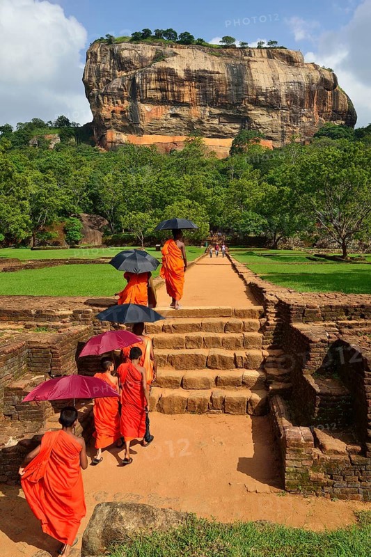 Buddhist monks on their way to the Lion Rock