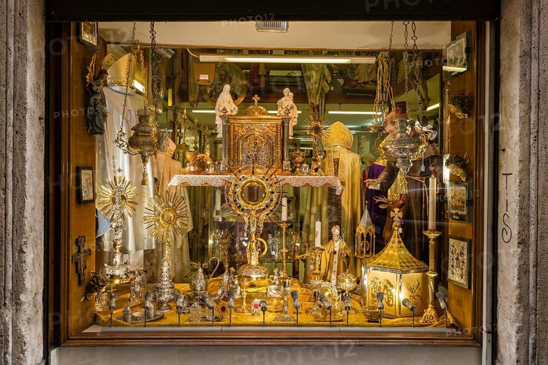 Shop window with devotional objects and goods for priests