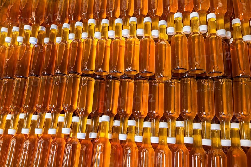 Bottles of apple cider in a wine cellar