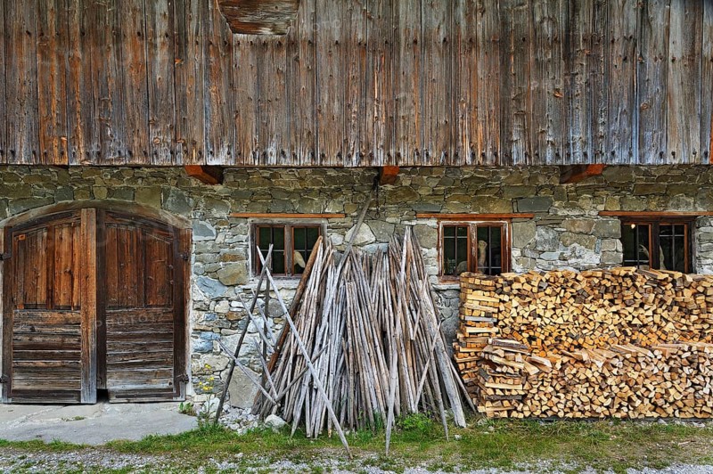 Hay drying poles and a woodpile in Markus Wasmeier Farm and Winter Sports Museum