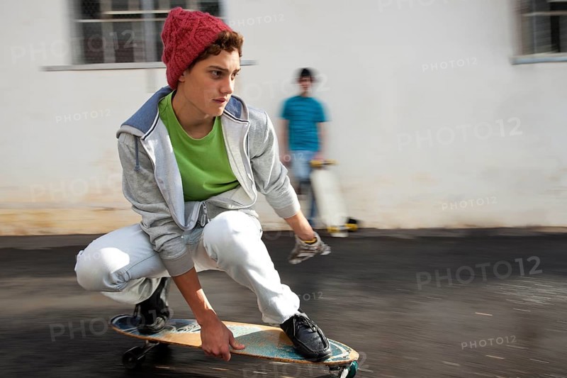 Teenager riding a longboard