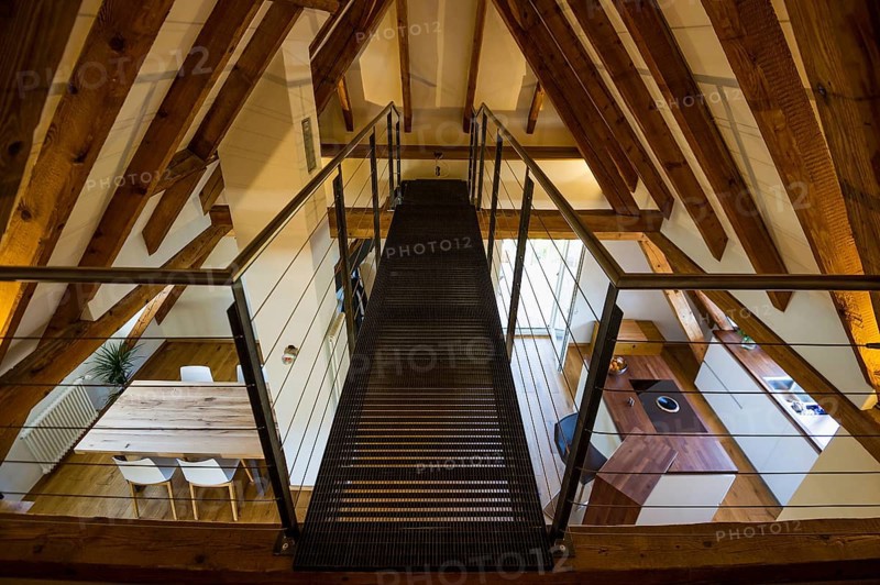 Converted loft with a living area and a modern kitchen