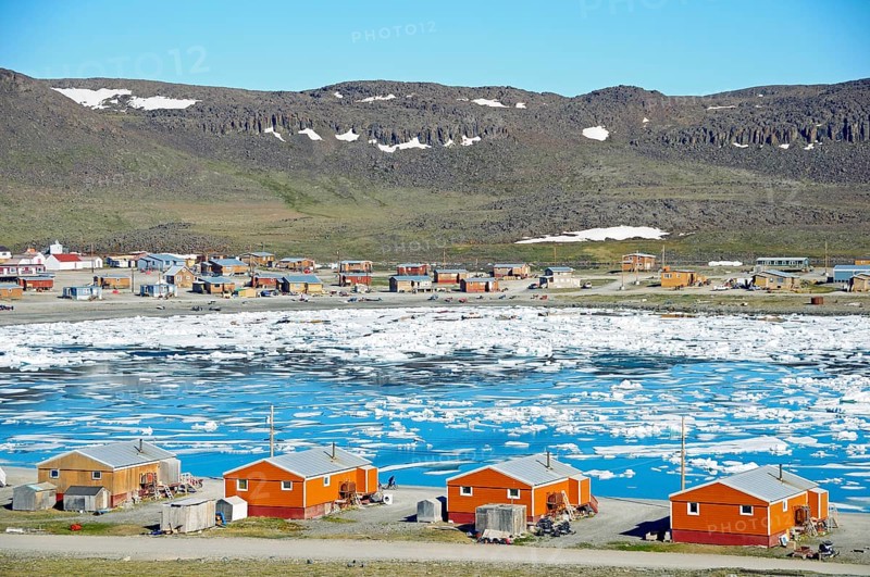 The Inuit village of Ulukhaktok with ice floes in the Beaufort Sea