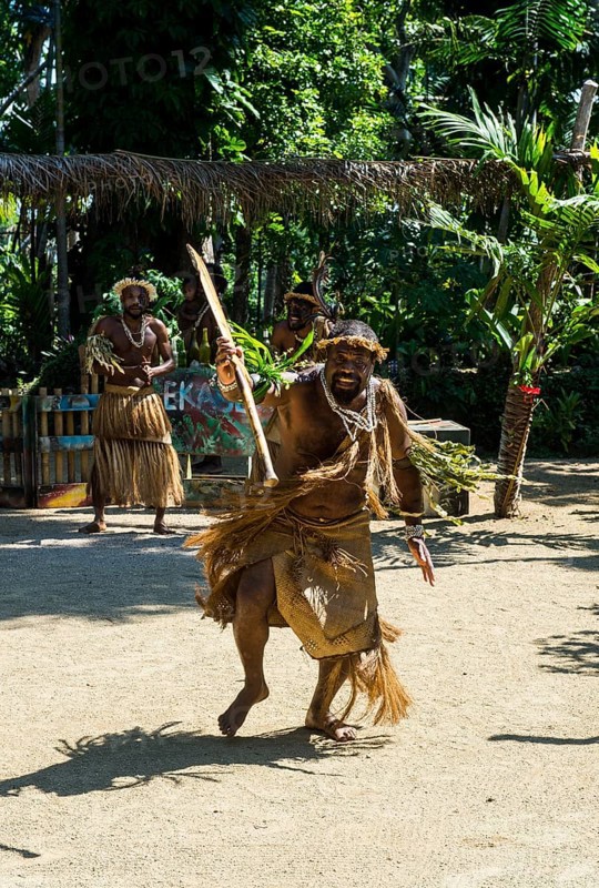 Man practising a traditional war ceremony