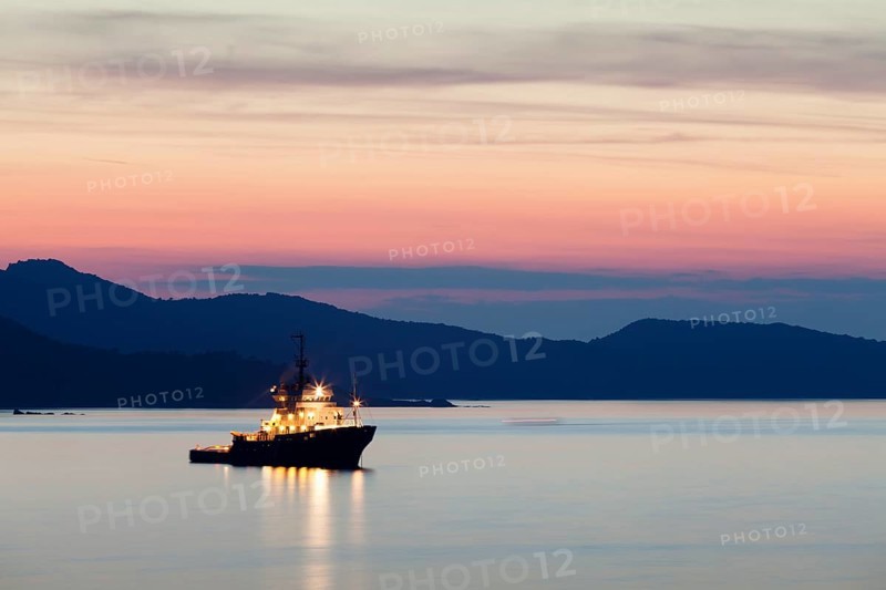 Boat at sunset on the Gulf of Saint-Florent