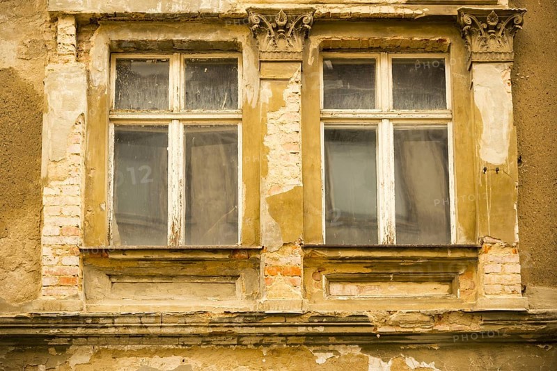 Window of a closed down hotel in need of refurbishment
