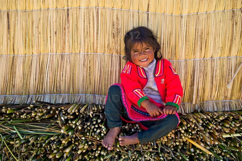 Smiling young girl the Uro Indians