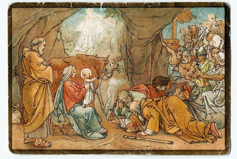 The three Magi kneeling before the Baby Jesus