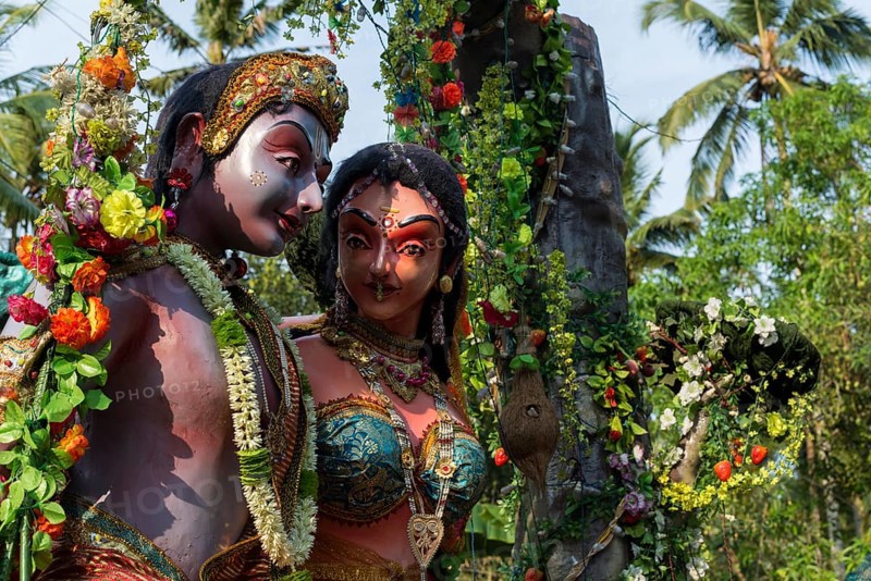 Shiva and Parvati sculptures displayed at a procession during a temple festival