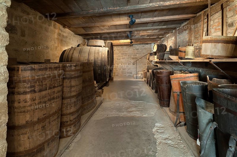 Old wine cellar with barrels of a winery