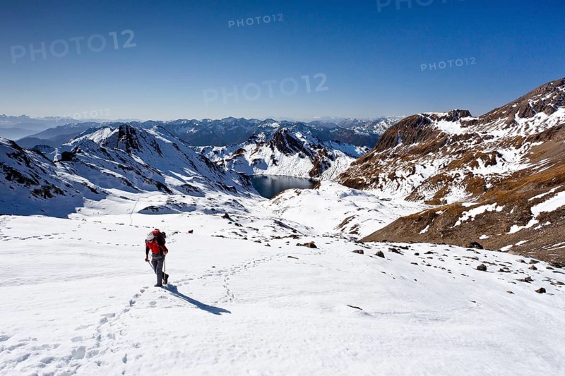 Mountain climber ascending Wilde Kreuzspitze Mountain in the Pfunderer Mountains