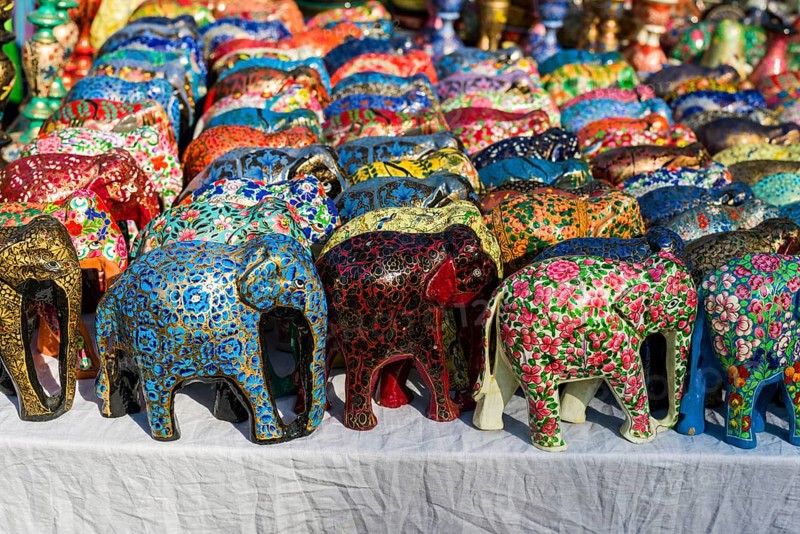 Colourful papier mache elephants for sale at the weekly flea market