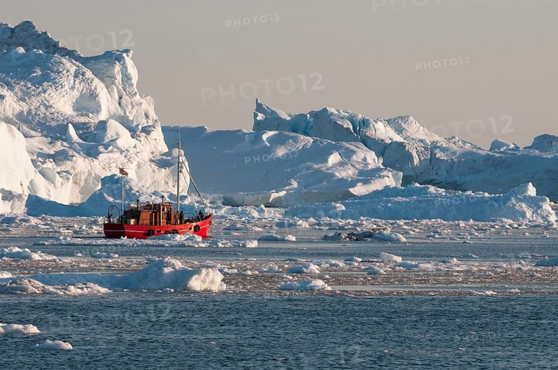 Boat between icebergs
