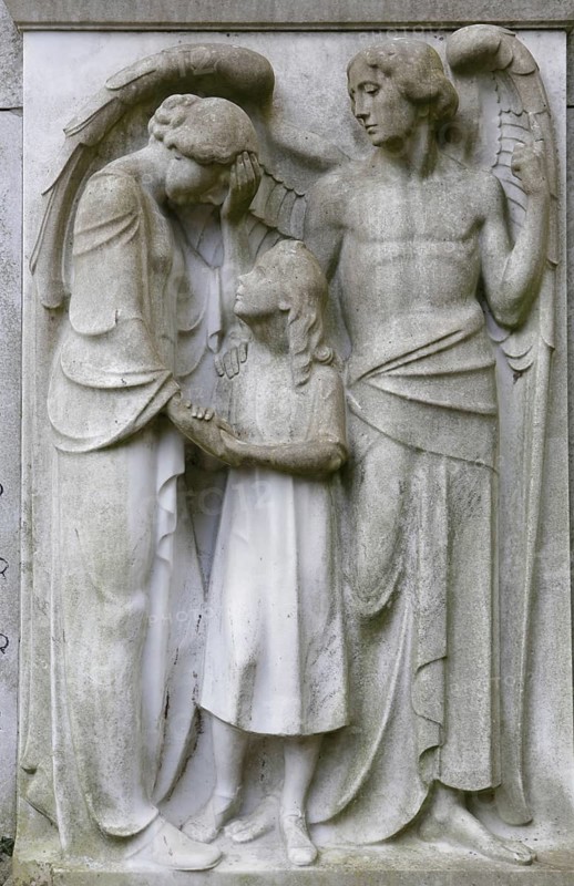 Angel with a mother and child on a gravestone