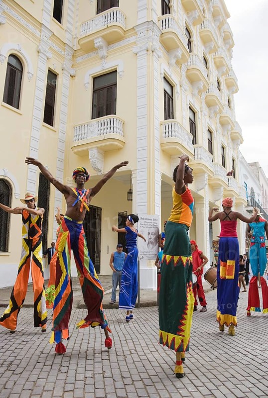 Street performers walking on stilts in Old Havana