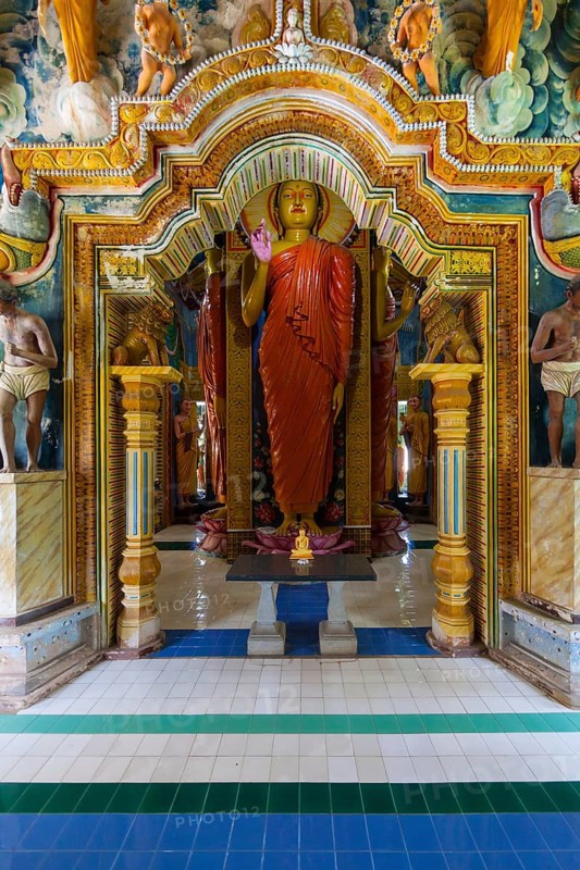 Statue in the old Buddhist temple complex of Sri Pushparama Maha Viharaya