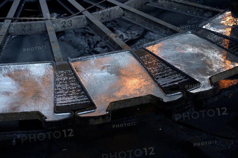 Liquid silver is being poured into molds