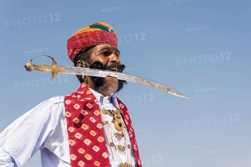 Local man posing with a sword in his mouth