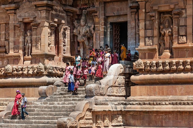 Devout Hindus and children descending a staircase