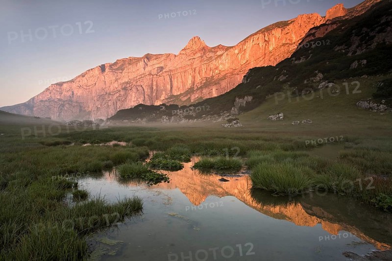 The rocks of the Sagzahn and Sonnwendjoch reflected in a high moor