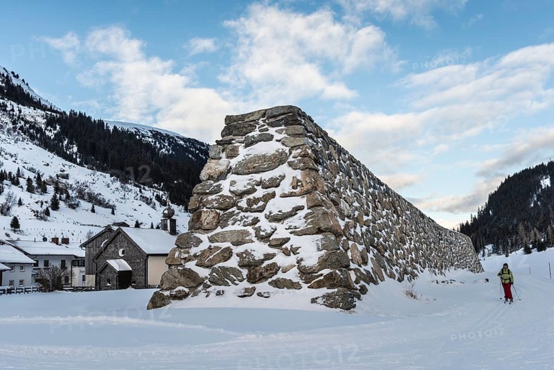 Stone wall as protection against avalanches